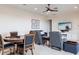 Living room with comfortable seating, a dining table, and a TV for entertainment at 5502 Tidewater Preserve Blvd, Bradenton, FL 34208