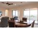 Living room with dining area featuring round table and chairs plus sliding door to patio at 5502 Tidewater Preserve Blvd, Bradenton, FL 34208