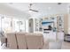Bright and airy living room featuring a custom built-in entertainment center and lots of seating at 5502 Tidewater Preserve Blvd, Bradenton, FL 34208