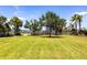 Community playground with green space and water views offers outdoor recreation and fun at 5502 Tidewater Preserve Blvd, Bradenton, FL 34208