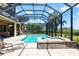 Inviting screened pool and spa with an adjoining covered patio, perfect for entertaining and enjoying the outdoors at 5502 Tidewater Preserve Blvd, Bradenton, FL 34208