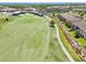 An aerial perspective of the home next to the golf course showcasing the desirable location at 5528 Palmer Cir # 204, Lakewood Ranch, FL 34211