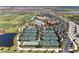 A beautiful aerial shot capturing a community with tennis courts, pool, golf course and many residences at 5528 Palmer Cir # 204, Lakewood Ranch, FL 34211