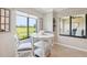 Charming breakfast nook with golf course views and natural light with comfortable seating at 5528 Palmer Cir # 204, Lakewood Ranch, FL 34211