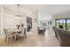 Inviting dining area with seating for four and open layout to kitchen and living spaces at 5528 Palmer Cir # 204, Lakewood Ranch, FL 34211
