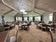 A beautiful dining area with lots of tables, chairs and light at 5528 Palmer Cir # 204, Lakewood Ranch, FL 34211