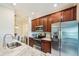 This kitchen is complete with stainless steel appliances, and beautiful wood cabinets at 5528 Palmer Cir # 204, Lakewood Ranch, FL 34211