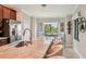 This open kitchen has a large island with barstool seating and stainless steel appliances at 5528 Palmer Cir # 204, Lakewood Ranch, FL 34211