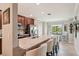 A stylish eat-in kitchen offers bar seating, stainless appliances, and granite countertops at 5528 Palmer Cir # 204, Lakewood Ranch, FL 34211