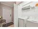 Clean laundry room featuring modern appliances with a wire rack for storage at 5528 Palmer Cir # 204, Lakewood Ranch, FL 34211