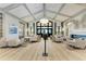 Spacious lobby features high ceilings, modern light fixture, comfortable seating and a cozy fireplace at 5528 Palmer Cir # 204, Lakewood Ranch, FL 34211