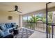 Enclosed patio with ceiling fan and comfortable seating area, offering a relaxing outdoor living space at 5528 Palmer Cir # 204, Lakewood Ranch, FL 34211