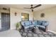 Cozy patio with comfortable seating, ceiling fan, and access door, creating a relaxing outdoor living space at 5528 Palmer Cir # 204, Lakewood Ranch, FL 34211