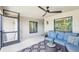 Screened-in patio with comfortable seating, a ceiling fan, and views of the outdoors, perfect for relaxing at 5528 Palmer Cir # 204, Lakewood Ranch, FL 34211