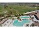 Aerial view of resort style swimming pools and golf course at 5528 Palmer Cir # 204, Lakewood Ranch, FL 34211