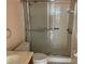 Bathroom featuring tiled shower with sliding doors at 5970 80Th N St # 101, St Petersburg, FL 33709