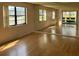 Bright living room featuring mirrored wall and sliding glass doors at 5970 80Th N St # 101, St Petersburg, FL 33709