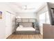 Bedroom features a bunk bed with wood-look floors and white trim at 6009 Lords Ave, Sarasota, FL 34231