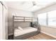 Bedroom features a bunk bed with wood-look floors and white trim at 6009 Lords Ave, Sarasota, FL 34231