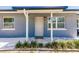 Inviting front entrance with modern door and landscaping at 6009 Lords Ave, Sarasota, FL 34231