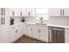 Bright modern kitchen featuring white cabinets and stainless steel appliances at 6009 Lords Ave, Sarasota, FL 34231