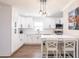 Stylish kitchen with white cabinetry, modern lighting, and ample counter space at 6009 Lords Ave, Sarasota, FL 34231