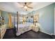 Comfortable bedroom with a ceiling fan and natural lighting at 610 Poinsettia Rd, Nokomis, FL 34275