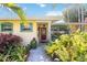 Charming single story home with a landscaped yard and inviting front entrance at 610 Poinsettia Rd, Nokomis, FL 34275