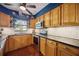 Well-lit kitchen with wooden cabinetry, stainless steel appliances, and granite countertops at 610 Poinsettia Rd, Nokomis, FL 34275