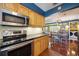 Kitchen with stainless steel appliances and modern finishes at 610 Poinsettia Rd, Nokomis, FL 34275