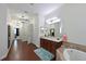 Bathroom featuring a tub, double vanity, and tile flooring at 6316 Foxbrook Trl, Parrish, FL 34219