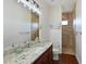 Bathroom showcasing granite countertop vanity and walk-in shower with mosaic tile at 6316 Foxbrook Trl, Parrish, FL 34219