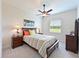 Bedroom with a ceiling fan, carpet, and a window at 6316 Foxbrook Trl, Parrish, FL 34219
