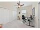 Neutral bedroom featuring a window with blinds, closet doors, and a ceiling fan at 6316 Foxbrook Trl, Parrish, FL 34219