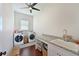 Laundry room with granite countertops, sink, washer, and dryer at 6316 Foxbrook Trl, Parrish, FL 34219