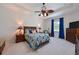 Sunlit main bedroom featuring cool color scheme, bedside tables and lamps, plus natural light at 6316 Foxbrook Trl, Parrish, FL 34219