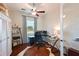 Cozy home office features modern desk, a large window, and a storage cabinet at 6316 Foxbrook Trl, Parrish, FL 34219