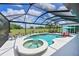 Sparkling pool and spa area within a screened enclosure, offering privacy and outdoor enjoyment at 6316 Foxbrook Trl, Parrish, FL 34219