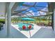 Relax by the pool, surrounded by a screened-in lanai, that is perfect for enjoying the Florida sunshine at 6316 Foxbrook Trl, Parrish, FL 34219