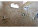 Tiled shower with a built in shelf and shower head at 6316 Foxbrook Trl, Parrish, FL 34219
