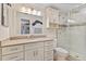 Bright bathroom featuring a neutral palette, framed mirror, and a glass-enclosed shower at 6400 Flotilla Dr # 87, Holmes Beach, FL 34217