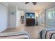 Bedroom with tile floors, ceiling fan, and sliding glass doors for natural light and ventilation at 6400 Flotilla Dr # 87, Holmes Beach, FL 34217