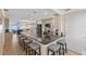 Modern kitchen with a large island, gray cabinets, updated appliances, and an open layout with a water view at 6400 Flotilla Dr # 87, Holmes Beach, FL 34217