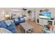 Inviting living room showcases coastal decor, wood flooring, and open layout to the kitchen at 6400 Flotilla Dr # 87, Holmes Beach, FL 34217