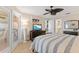 Comfortable main bedroom features a ceiling fan, private balcony access, and a bright, airy feel at 6400 Flotilla Dr # 87, Holmes Beach, FL 34217