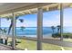 Breathtaking waterfront view through large windows, highlighting the serene ocean and blue sky at 6400 Flotilla Dr # 87, Holmes Beach, FL 34217