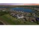 Sunset community view highlighting tile roofs, solar panels, and refreshing backyard pools at 6535 Clairborne Ln, Bradenton, FL 34211