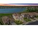 An aerial view of upscale homes near a serene lake and lush green landscapes at 6535 Clairborne Ln, Bradenton, FL 34211
