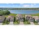 Beautiful lakefront homes boasting tile roofs, paver driveways and lush landscaping at 6535 Clairborne Ln, Bradenton, FL 34211