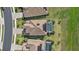 A high angle view of luxury homes featuring pools, tile roofs, and well-kept lawns at 6535 Clairborne Ln, Bradenton, FL 34211